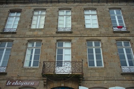 Traditional french stone building with many windows