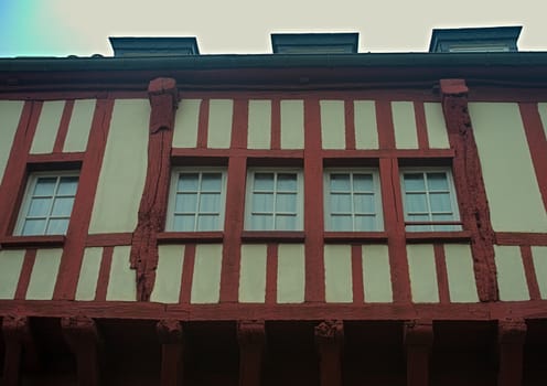 Windows and facade on medieval house in Dinon, France