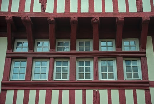 Windows and facade on medieval house in Dinon, France