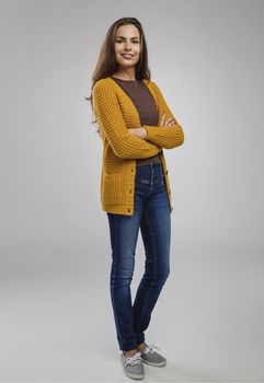 Shot of a beautiful young woman over a gray background