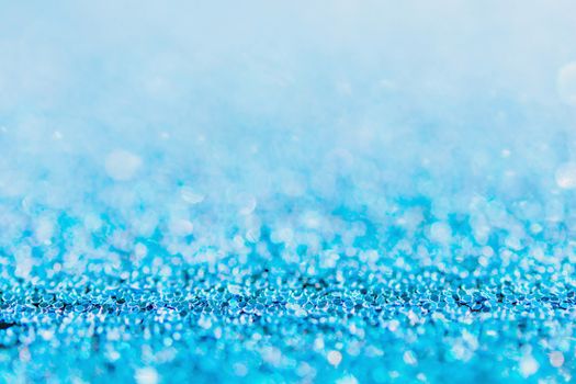 Defocused blue glitter background. blue abstract bokeh background. Christmas abstract background
