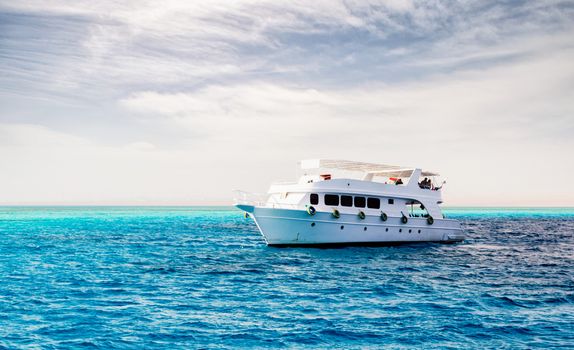 white cruise tourist boat on the background of the coast in the Red Sea in Sharm El Sheikh Egypt