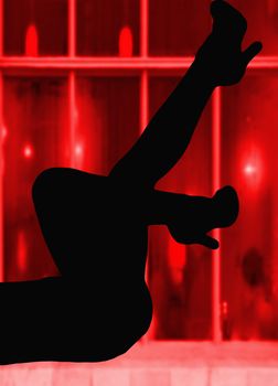 silhouette of sexy lady legs in front of some red windows hooker concept