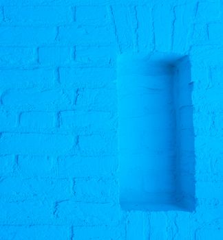 Modern neon blue colored brick wall texture background with empty framework opening