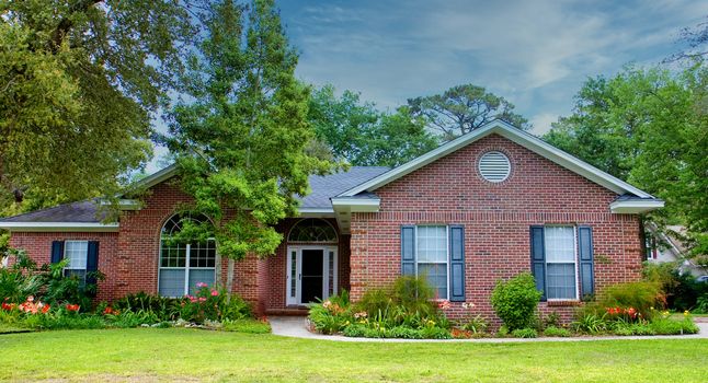 A nice brick house on a hot summer southern lawn