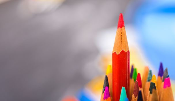 Back to school, Red pencil standing out from crowd, plenty business success concept