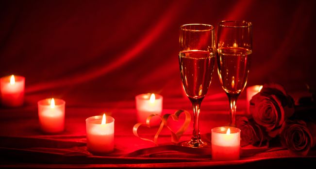 Valentines day background with champagne glasses roses candles and hearts