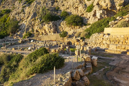 The ancient temple of Hera on the gulf beside the Heraion cape near Perachora village in Greece at sunset.