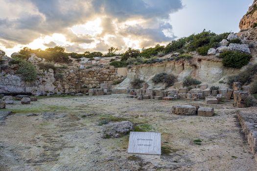 The ancient temple of Hera on the gulf beside the Heraion cape near Perachora village in Greece at sunset.