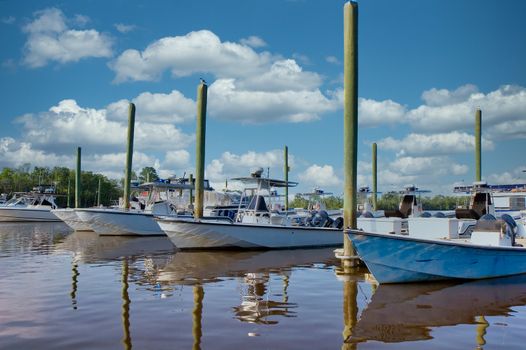 Boats in a small marina with reflections