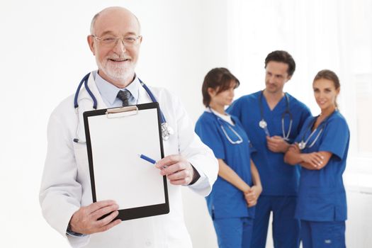 Group of doctors , senior specialist holding folder with blank document isolated on white background, studio shot