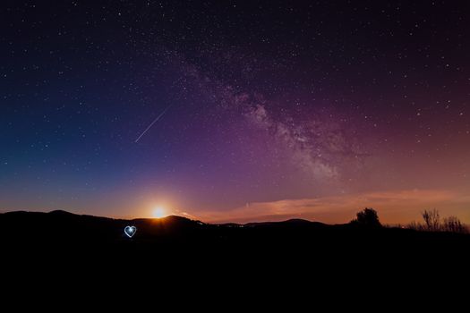 Atmospheric night in the Black Forest with a super full moon and the Milky Way.