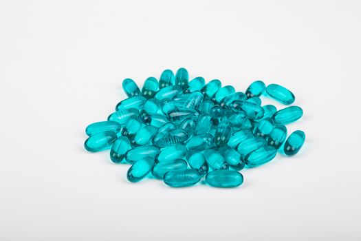 Blue Gel Capsules on White Background