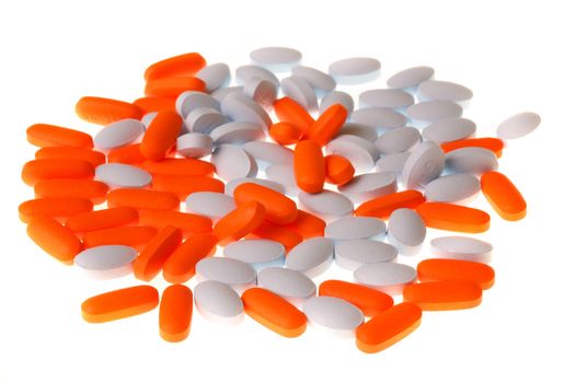 Orange and blue pills isolated on a white background