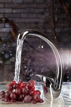 Water mixer and fruits on a studio background