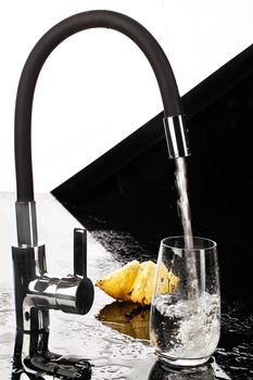 Water mixer and fruits on a studio background
