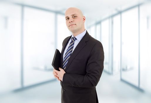 proud businessman with a tablet pc, at the office