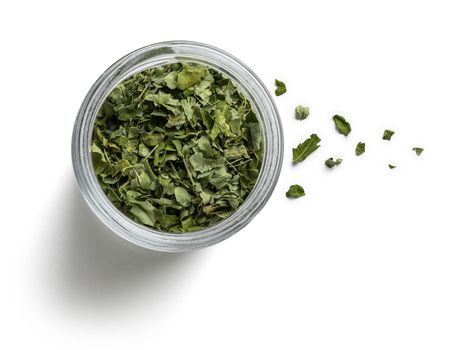 Dried Moringa on a white background. The view from the top.