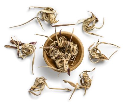 Dry artichoke flowers on a white background. The view from the top.