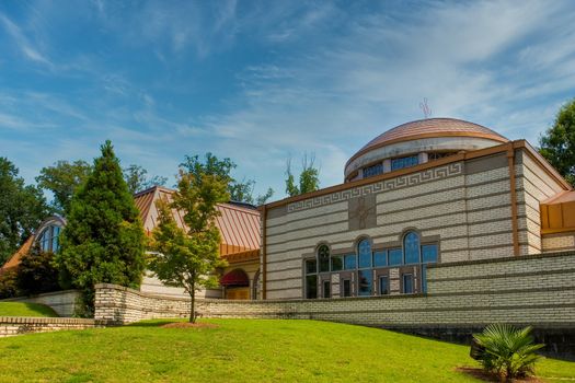 A modern greek orthodox church under blue skies