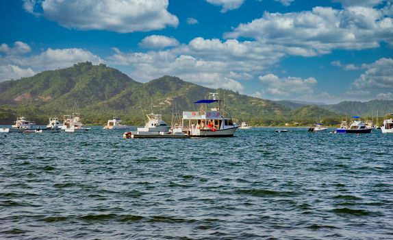 Old diving boats moored off a tropical coast