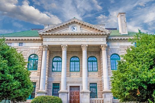 An old granite courthouse in the early morning light