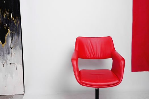Modern red armchair on a white background in the studio