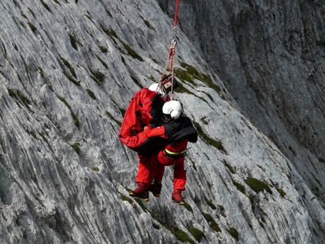 Rescue helicopter in mission at Himalaya mountain.