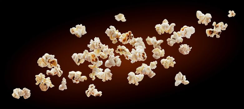 Popcorn isolated on black background. Falling or flying popcorn with copy space. Close-up