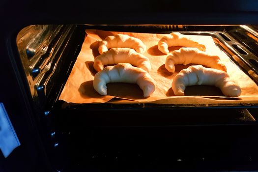 Homemade pastries, croissants in the oven. 