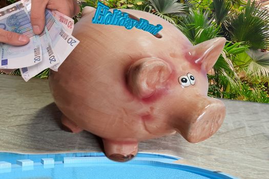 Piggy bank with inscription in English holiday fund