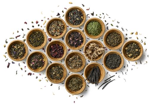 Large assortment of tea on a white background. The view from the top.