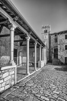 view of Sveti Lovrec and St. Martin's Church bell tower, black and white, Istria, Croatia