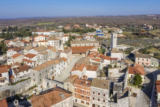 an aerial view of Sveti Lovrec and St. Martin's Church bell tower, Istria, Croatia