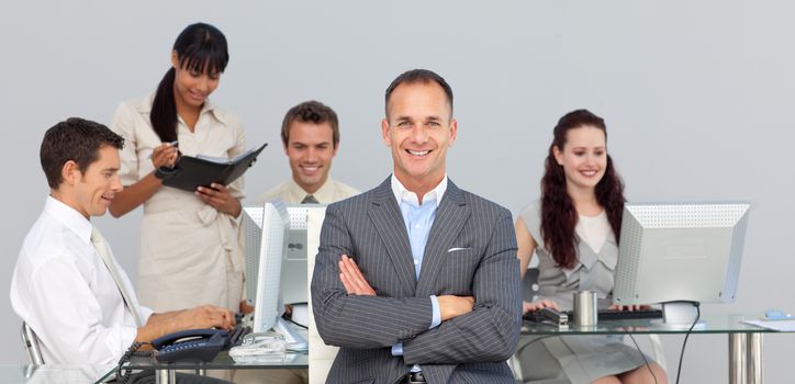 Concentrated Business partners working with their manager in the foreground