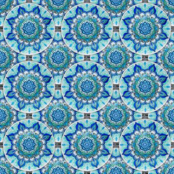 Seamless background from a set of decorative ceramic dishes hand-painted with acrylic paints with a floral pattern.