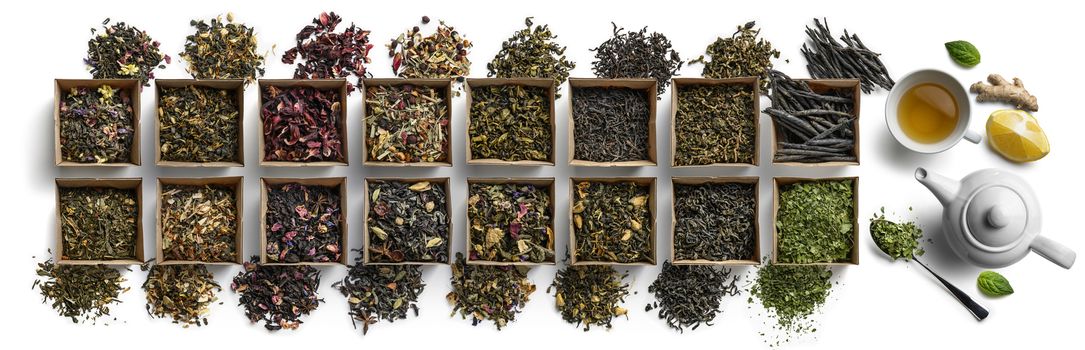 Large assortment of tea on a white background. The view from the top.