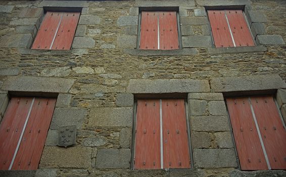 Traditional french stone building with many windows