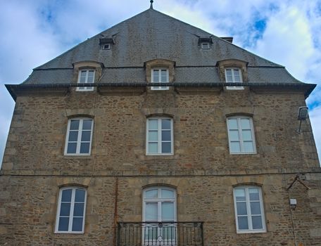 Traditional french stone building with many windows