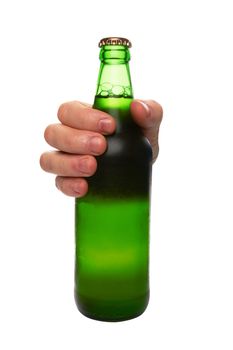 hand holding a green beer bottle without label isolated on white background