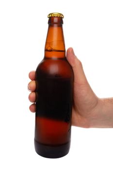 hand holding a beer bottle without label isolated on white background