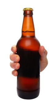 hand holding a beer bottle without label isolated on white background