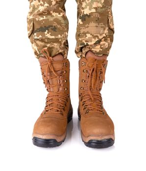 soldier legs in army boots isolated on white background