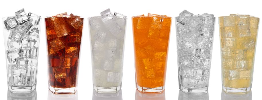 Glasses with sweet drinks with ice cubes isolated on white