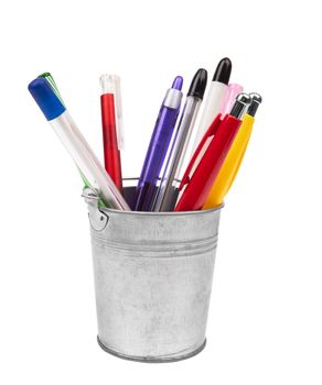 A set of colored pens in a bucket isolated on a white background