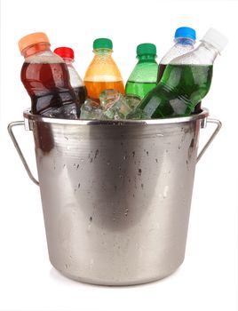 cold beverages in plastic bottles on heap of ice cubes