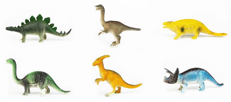 Toy dinosaurs on white background