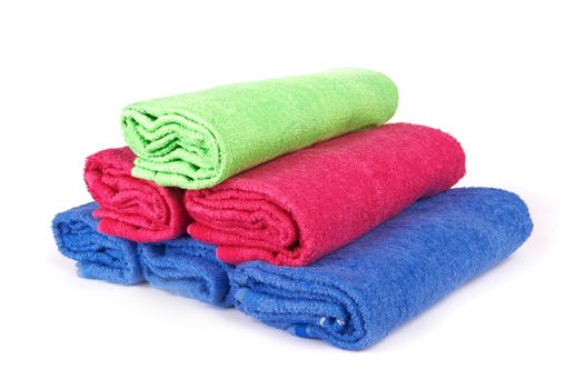 stacked colorful towels on a white background 