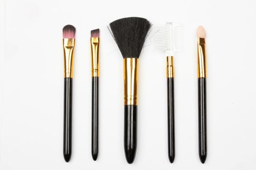set of make-up brushes on white 