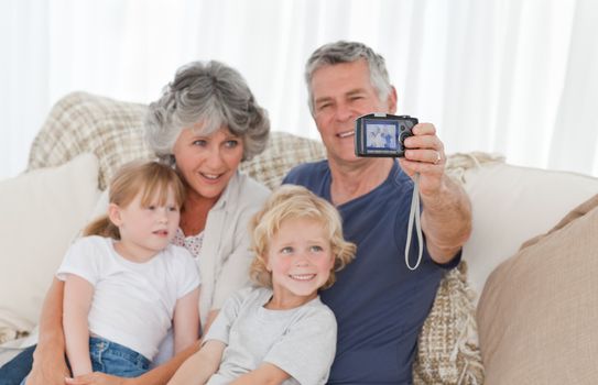 Family taking a photo of themselves at home